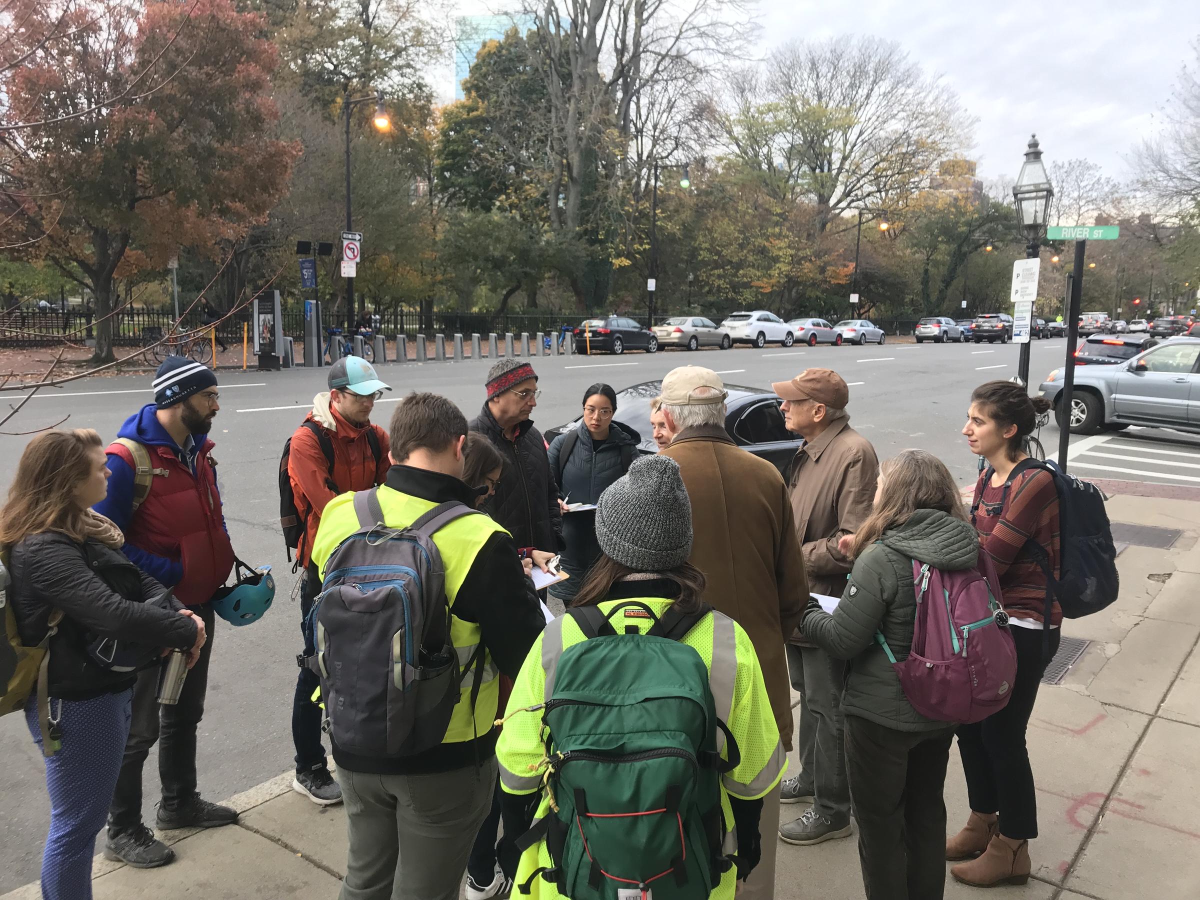 Photo showing participants in the Back Bay Community Walk; about 15 people gathered in a group on a sidewalk.