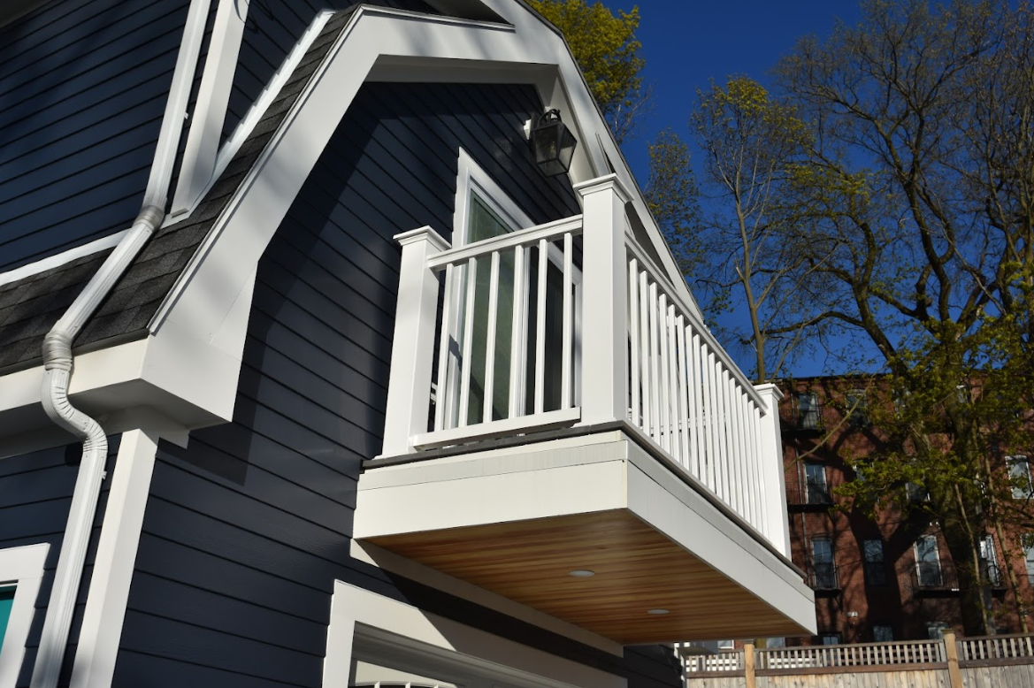 Outside of a detached ADU, looking upwards toward the balcony.