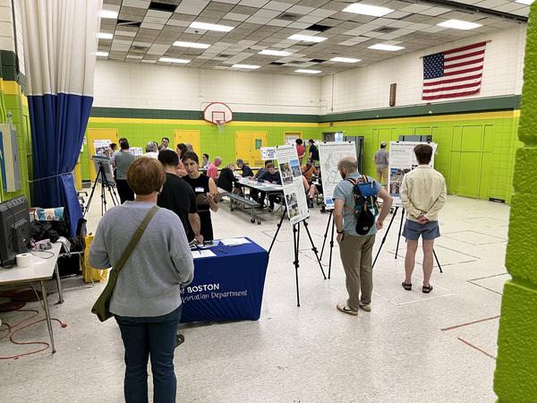 Photo of people in a gymnasium attending the second JP open house.