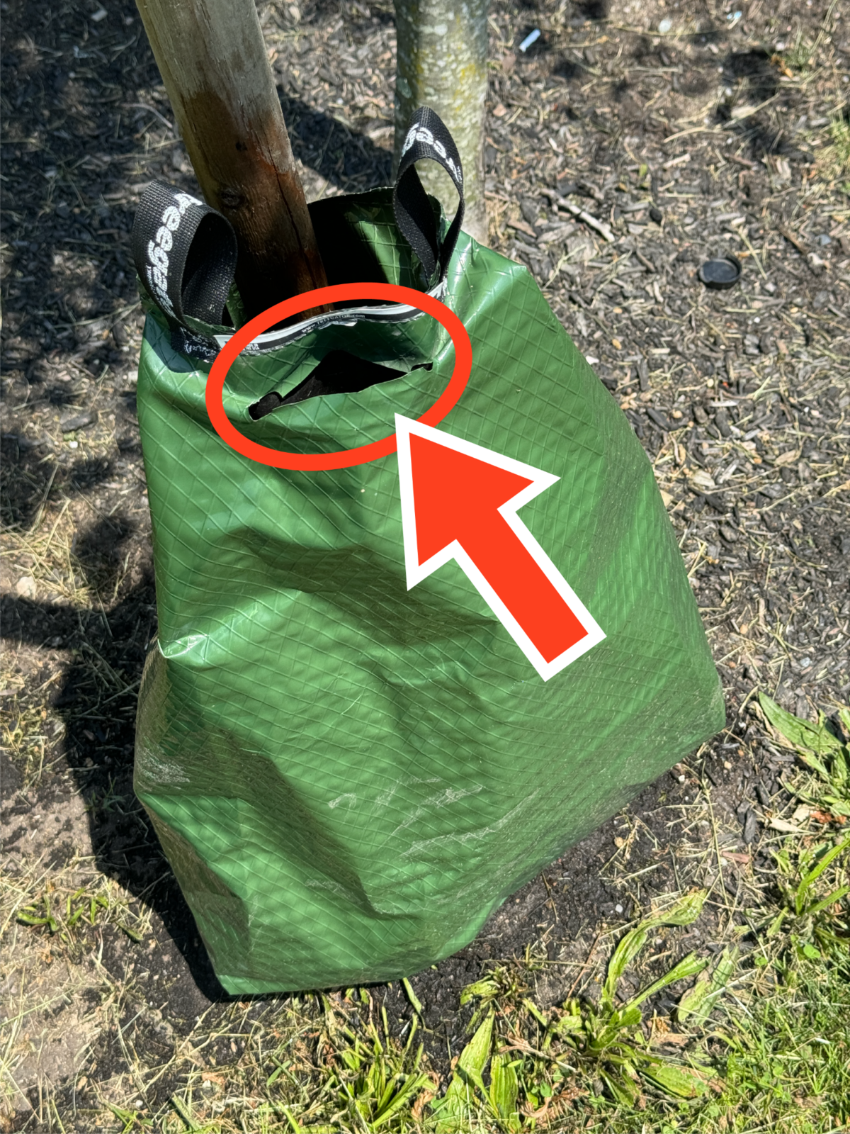 An arrow points to the opening of a watering bag with a circle for emphasis.
