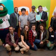 Image for mayor walsh poses for photos with award winners at the annual greenovate boston awards at fenway park in boston in 2016 