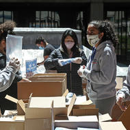 Volunteers putting together community care kits