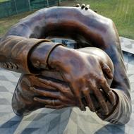 Photo of "The Embrace" memorial by Hank Willis Thomas, courtesy of Skanska