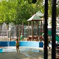 Child playing in splash pad