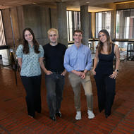 Photo of four Northeastern University Co-ops in City Hall 
