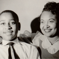 Emmett Till smiling with his mother.